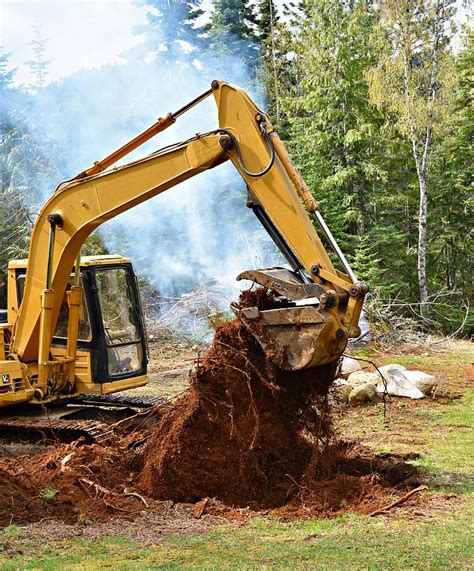 digging up stumps with mini excavator|excavators for pine tree stumps.